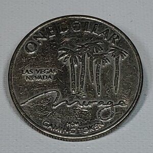 VINTAGE MIRAGE CASINO SILVER ONE DOLLAR GAMING TOKEN 1989 BY NEVADA COIN MINTING